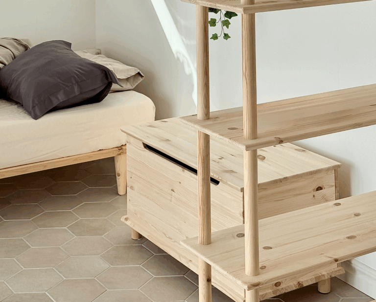 Full room shot featuring the tall, raw pine Air Shelf six-tiered unit, the matching wooden Storage Chest, and the Air bed frame 90x200, demonstrating a cohesive minimalist bedroom design.
