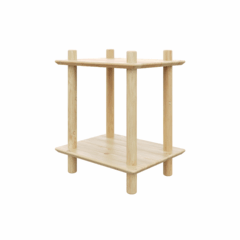 Slightly angled perspective of the raw pine Rohe Air two-tier modular shelf, highlighting its round legs and clean edges in a studio setting.